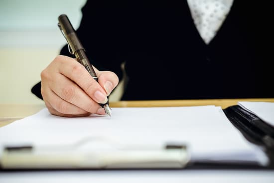 A person writing a special hardship licence application after a driving licence suspension.